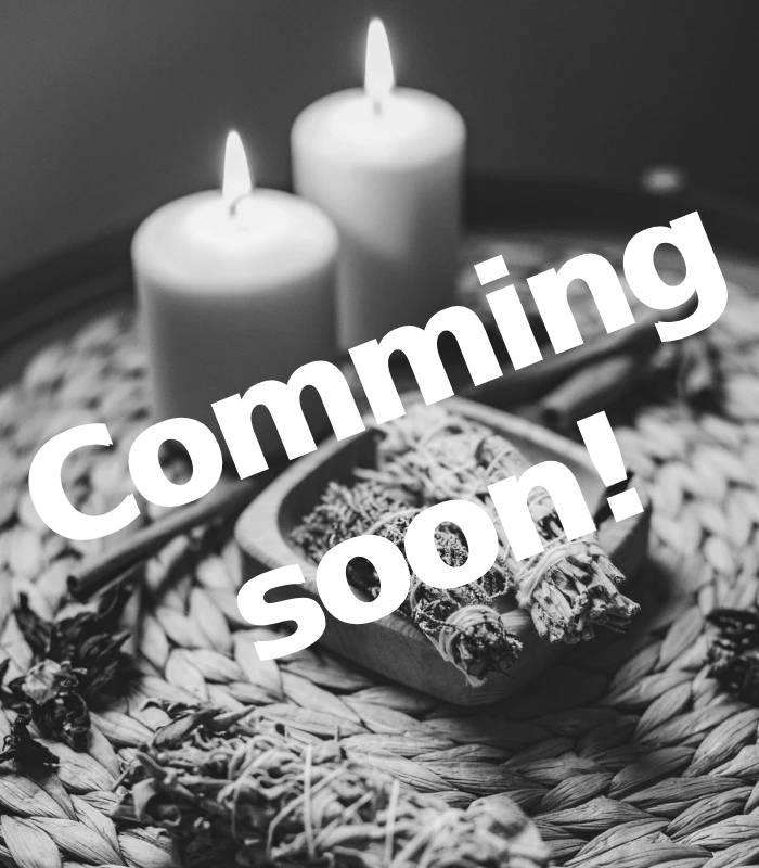 Herbs and candlelight representing postpartum healing during a Closing of the Bones ceremony